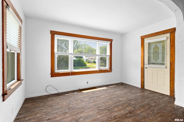 1603 Willow St, Pekin, IL 61554 - unfurnished room featuring dark wood finished floors and arched walkways