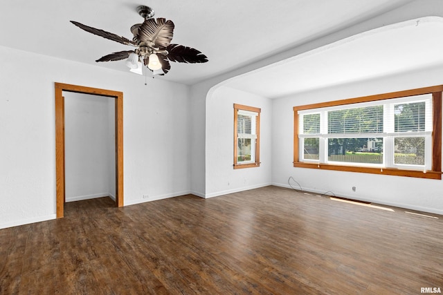 1603 Willow St, Pekin, IL 61554 - unfurnished room with wood finished floors, ceiling fan, and arched walkways