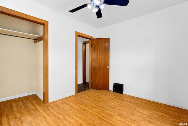 1603 Willow St, Pekin, IL 61554 - unfurnished bedroom with light wood-type flooring, a closet, and a ceiling fan