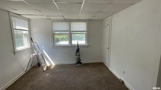 1009 W Armstrong Ave, Peoria, IL 61606 - carpeted empty room featuring a paneled ceiling and baseboards