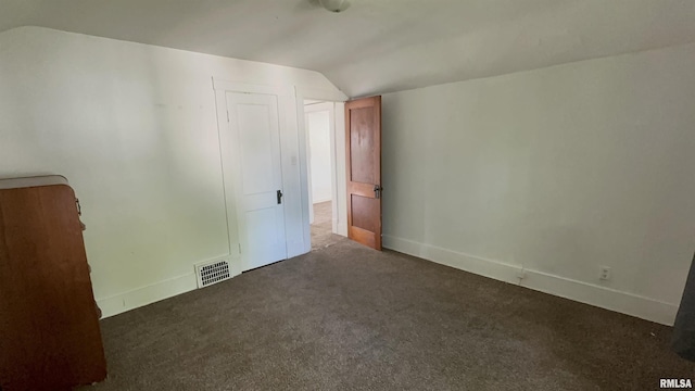 1009 W Armstrong Ave, Peoria, IL 61606 - unfurnished bedroom with lofted ceiling and carpet