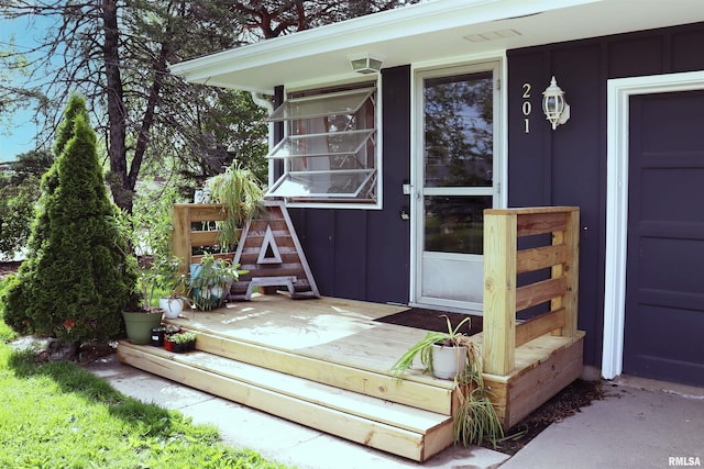 201 Willa Ln, Washington, IL 61571 - property entrance with board and batten siding and a wooden deck