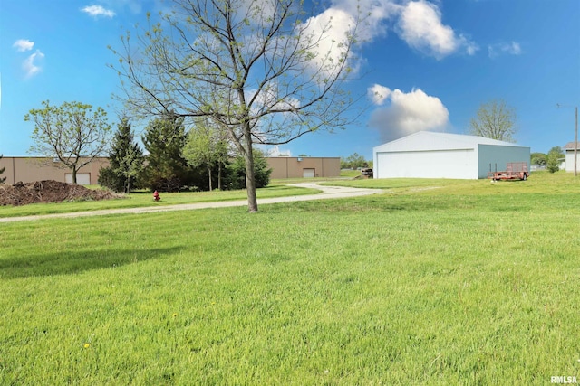 201 Willa Ln, Washington, IL 61571 - view of grassy yard with a garage, an outbuilding, and a pole building