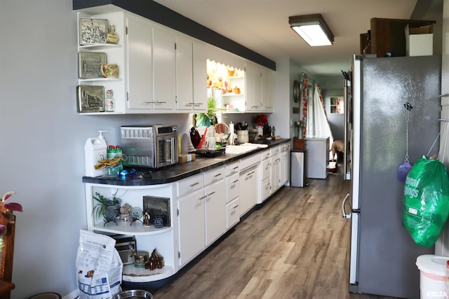 201 Willa Ln, Washington, IL 61571 - kitchen featuring freestanding refrigerator, open shelves, dark countertops, wood finished floors, and white cabinetry