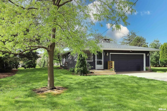 201 Willa Ln, Washington, IL 61571 - ranch-style house with concrete driveway, an attached garage, a front yard, and board and batten siding