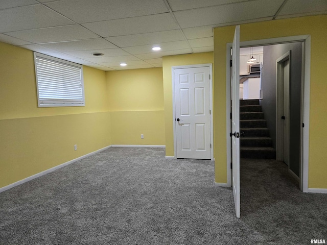 102 Conch Dr, La Harpe, IL 61450 - basement with carpet floors, a drop ceiling, stairs, and recessed lighting