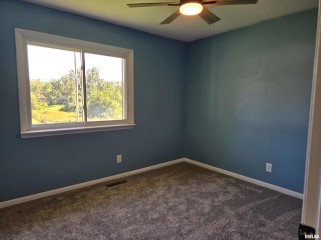 102 Conch Dr, La Harpe, IL 61450 - unfurnished room featuring ceiling fan and dark carpet