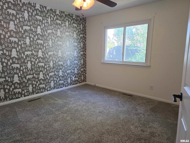 102 Conch Dr, La Harpe, IL 61450 - unfurnished room featuring carpet flooring, a ceiling fan, and wallpapered walls