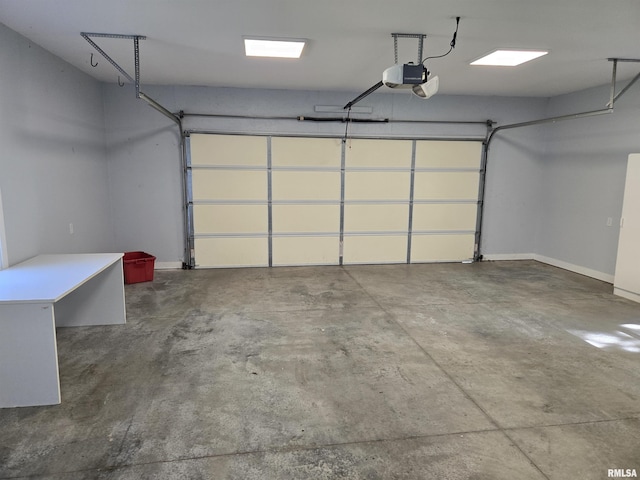102 Conch Dr, La Harpe, IL 61450 - garage with a garage door opener and baseboards