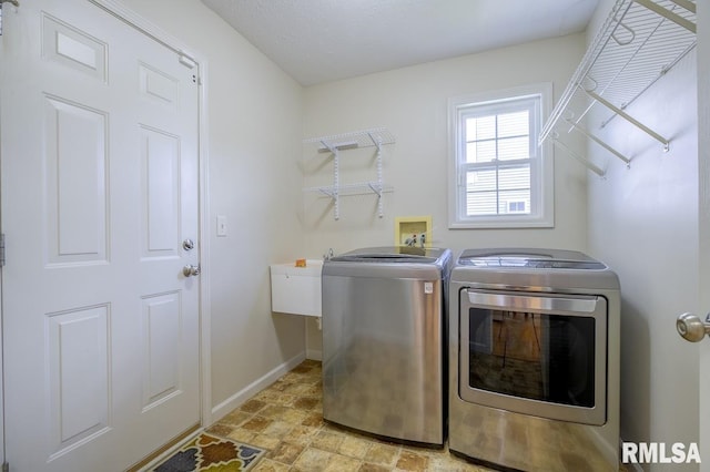 1508 W Meadowview Dr, Dunlap, IL 61525 - laundry room with washing machine and dryer and light stone finish flooring