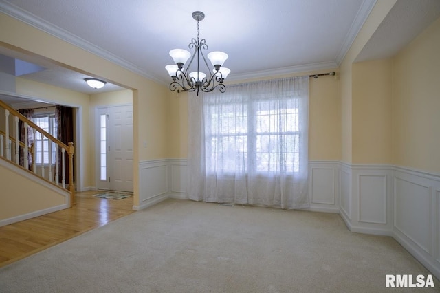 1508 W Meadowview Dr, Dunlap, IL 61525 - empty room with carpet floors, plenty of natural light, a chandelier, stairs, and crown molding