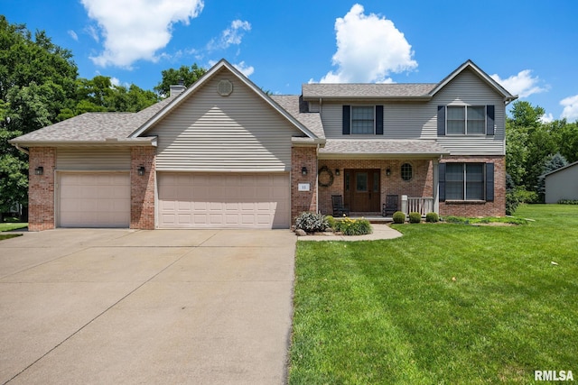 11 Lahood Ln, Washington, IL 61571 - traditional-style home featuring a garage, brick siding, concrete driveway, covered porch, and a front yard
