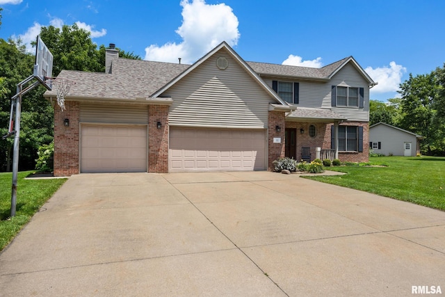 11 Lahood Ln, Washington, IL 61571 - traditional-style house with brick siding, an attached garage, concrete driveway, a front yard, and a chimney