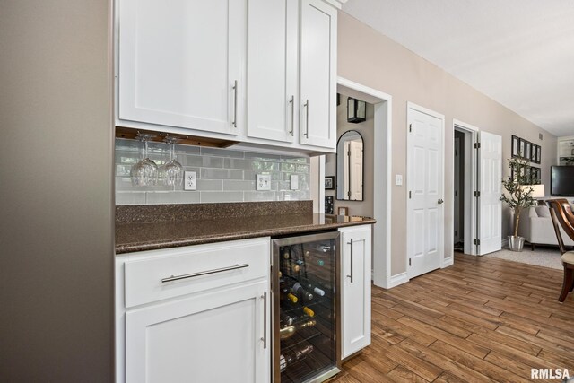 11 Lahood Ln, Washington, IL 61571 - indoor dry bar with beverage cooler, backsplash, and wood finished floors