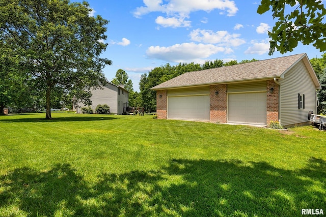 11 Lahood Ln, Washington, IL 61571 - view of grassy yard with a detached garage and an outbuilding