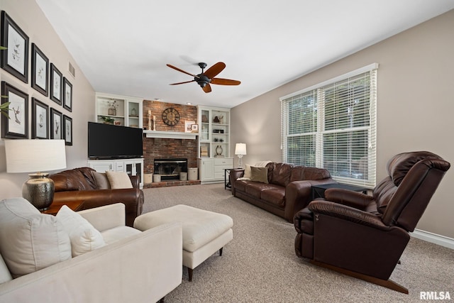 11 Lahood Ln, Washington, IL 61571 - carpeted living area featuring ceiling fan, a brick fireplace, and built in features