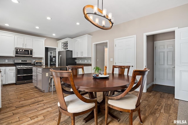 11 Lahood Ln, Washington, IL 61571 - dining space featuring light wood-style flooring, a chandelier, and recessed lighting