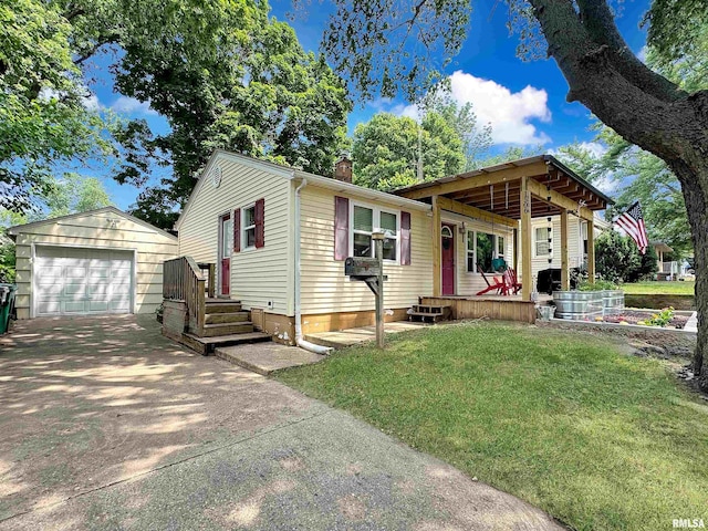 1506 S Capitol St, Pekin, IL 61554 - view of front facade featuring an outdoor structure, a front yard, a garage, a chimney, and concrete driveway