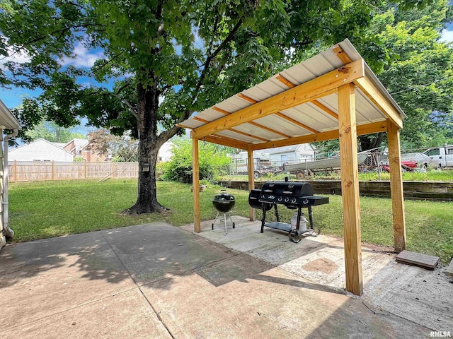 1506 S Capitol St, Pekin, IL 61554 - fenced backyard with a carport, grilling area, and a patio area