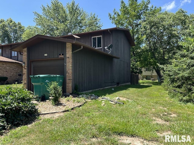 15 Cedar Dr, Macomb, IL 61455 - view of property exterior with a garage and a lawn