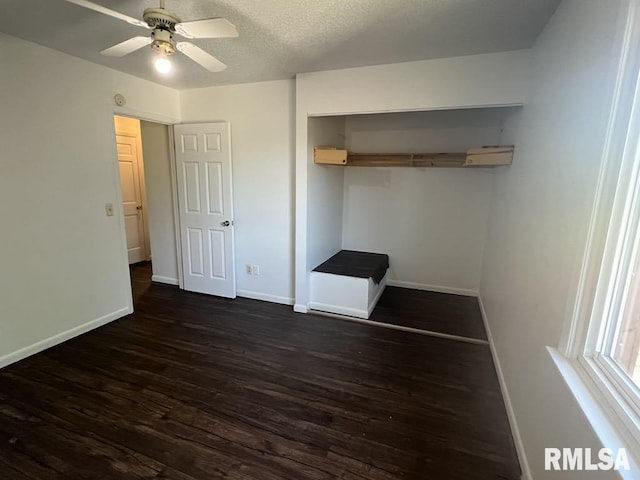 15 Cedar Dr, Macomb, IL 61455 - unfurnished bedroom with dark wood finished floors, a closet, a ceiling fan, and a textured ceiling
