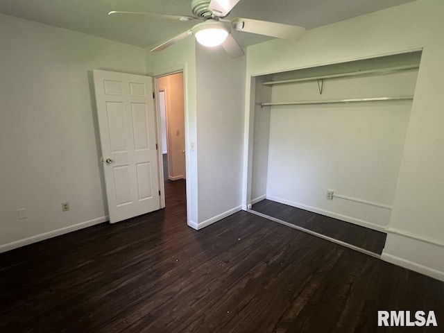 15 Cedar Dr, Macomb, IL 61455 - unfurnished bedroom featuring dark wood finished floors, ceiling fan, and a closet