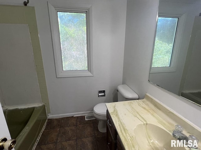 15 Cedar Dr, Macomb, IL 61455 - bathroom with vanity, stone finish flooring, and shower / washtub combination