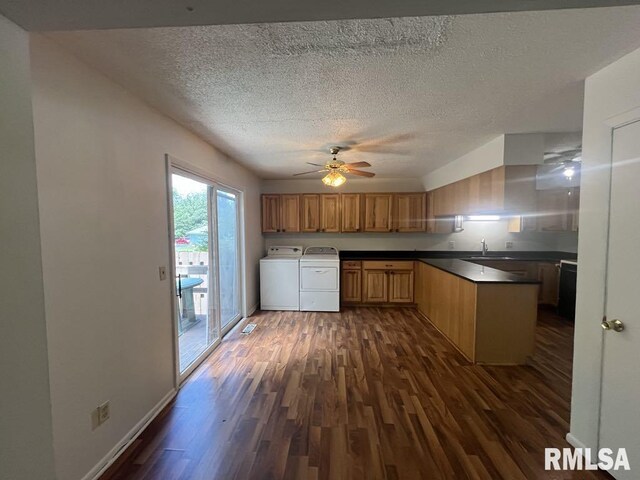 15 Cedar Dr, Macomb, IL 61455 - kitchen with washing machine and dryer, dark wood-style floors, ceiling fan, a textured ceiling, and dark countertops