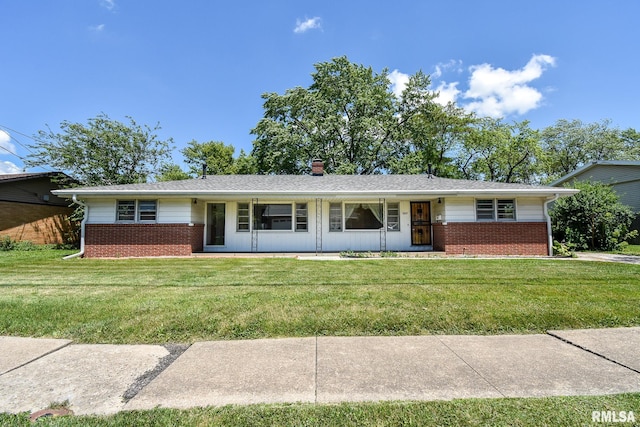 1602 Highwood Ave, Pekin, IL 61554 - single story home with brick siding, a front yard, and a chimney