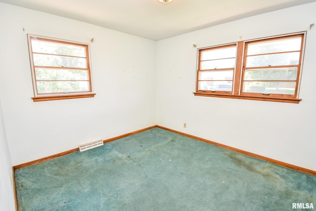 1602 Highwood Ave, Pekin, IL 61554 - empty room with plenty of natural light and carpet floors