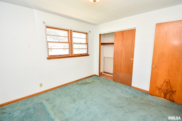 1602 Highwood Ave, Pekin, IL 61554 - unfurnished bedroom featuring carpet flooring and a closet