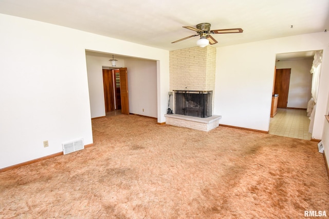 1602 Highwood Ave, Pekin, IL 61554 - unfurnished living room featuring a fireplace, carpet flooring, and a ceiling fan