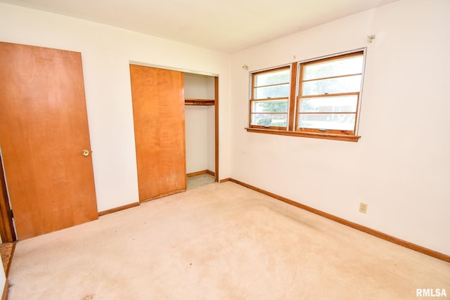 1602 Highwood Ave, Pekin, IL 61554 - unfurnished bedroom featuring a closet and carpet floors