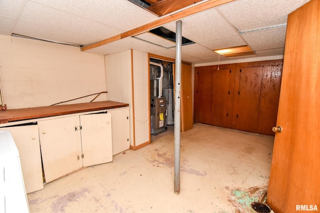1602 Highwood Ave, Pekin, IL 61554 - finished below grade area featuring a drop ceiling and gas water heater