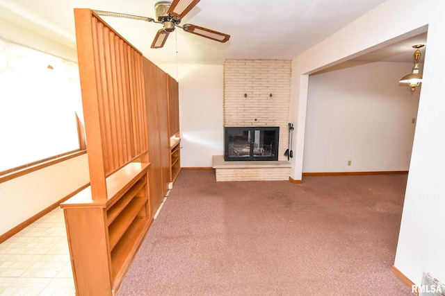 1602 Highwood Ave, Pekin, IL 61554 - unfurnished living room featuring a ceiling fan, a brick fireplace, and carpet flooring