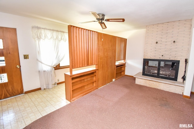1602 Highwood Ave, Pekin, IL 61554 - unfurnished living room with ceiling fan, a fireplace, and healthy amount of natural light