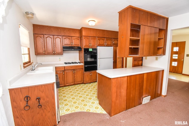 1602 Highwood Ave, Pekin, IL 61554 - kitchen with white appliances, a warming drawer, under cabinet range hood, and brown cabinets
