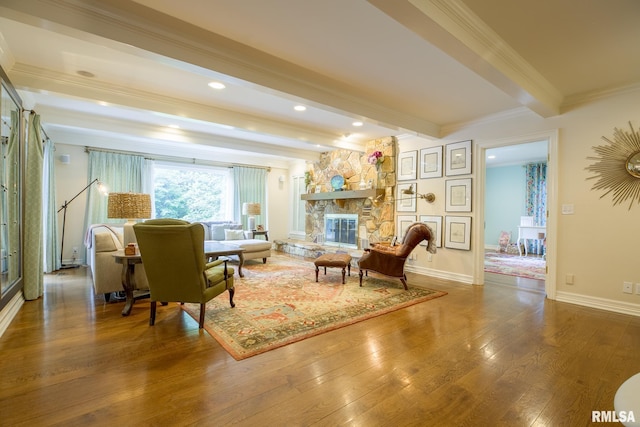 512 Hidden Ln, Peoria, IL 61614 - living area featuring beam ceiling, wood finished floors, ornamental molding, recessed lighting, and a fireplace