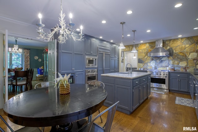 512 Hidden Ln, Peoria, IL 61614 - kitchen featuring stainless steel appliances, wall chimney exhaust hood, a chandelier, gray cabinetry, and crown molding