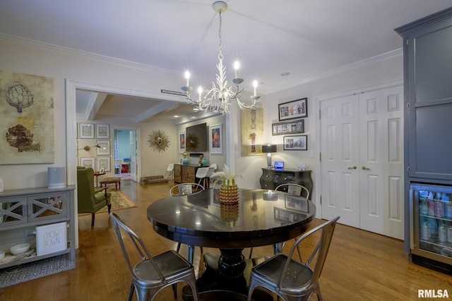 512 Hidden Ln, Peoria, IL 61614 - dining room with a chandelier, crown molding, wood finished floors, and wine cooler
