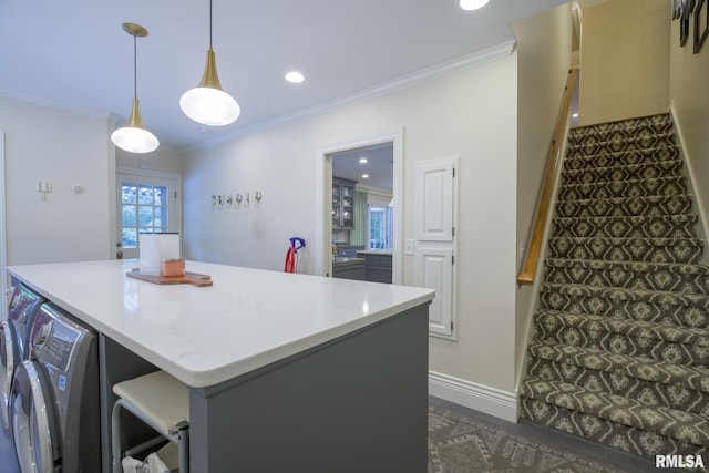 512 Hidden Ln, Peoria, IL 61614 - kitchen with washer and dryer, ornamental molding, a kitchen island, decorative light fixtures, and recessed lighting