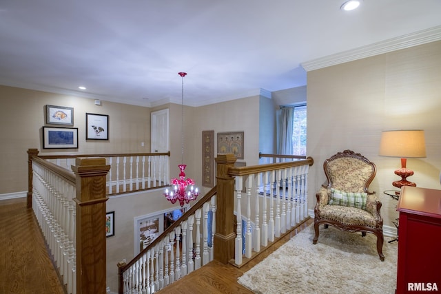 512 Hidden Ln, Peoria, IL 61614 - hall with an upstairs landing, wood finished floors, recessed lighting, and ornamental molding