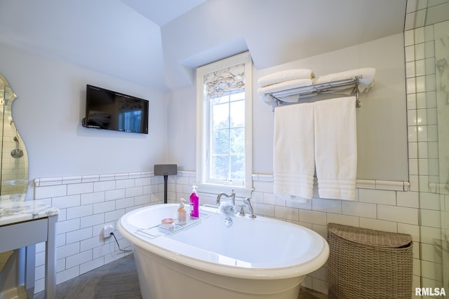 512 Hidden Ln, Peoria, IL 61614 - full bathroom featuring tile walls, a soaking tub, wainscoting, and vanity