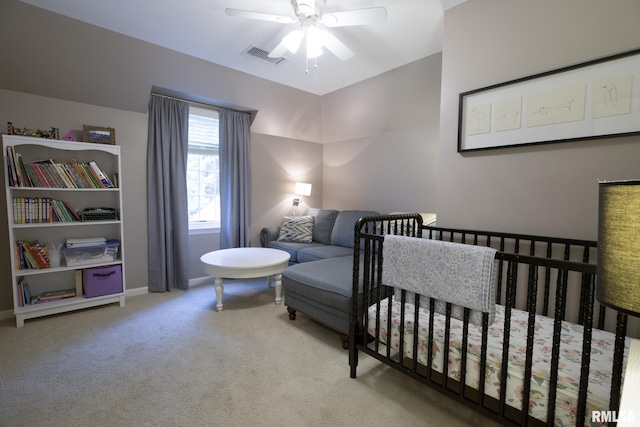 512 Hidden Ln, Peoria, IL 61614 - carpeted bedroom featuring ceiling fan and a crib