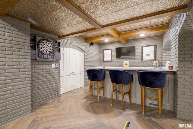 512 Hidden Ln, Peoria, IL 61614 - bar featuring brick wall and beamed ceiling