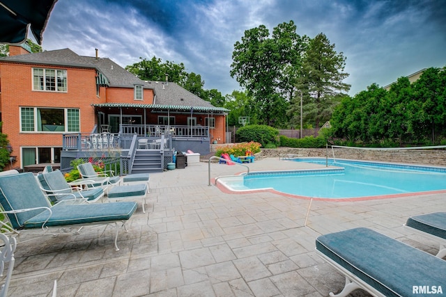 512 Hidden Ln, Peoria, IL 61614 - swimming pool featuring a patio area, stairs, and a deck
