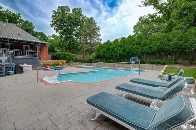 512 Hidden Ln, Peoria, IL 61614 - view of swimming pool featuring a fenced backyard, a patio area, a deck, and view of scattered trees