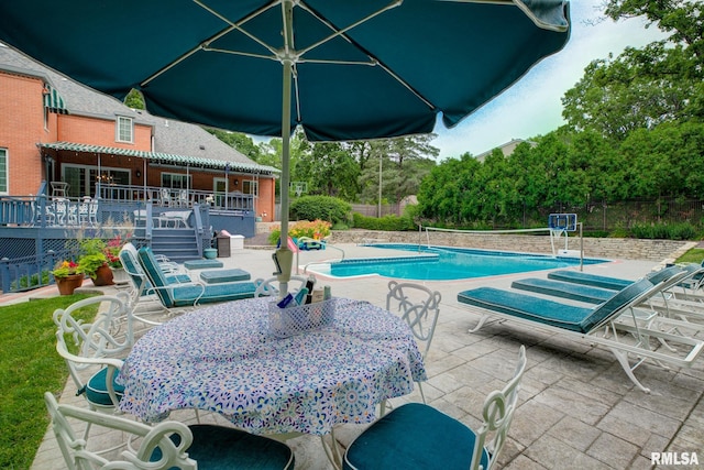 512 Hidden Ln, Peoria, IL 61614 - view of pool with a wooden deck, a patio area, and outdoor dining space