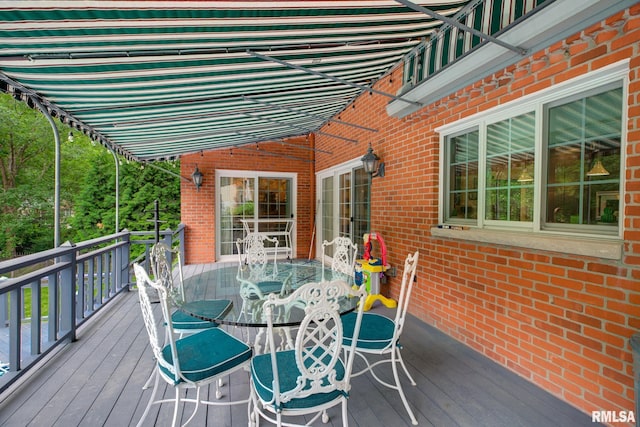 512 Hidden Ln, Peoria, IL 61614 - wooden terrace featuring outdoor dining area