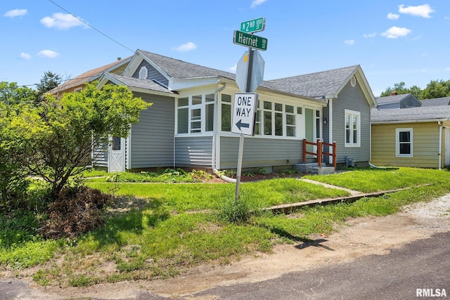 1013 N 2nd St, Pekin, IL 61554 - view of front of property with roof with shingles and a chimney